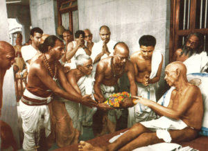 Photo of Ramana Maharshi Blessing the offering to the Mother's Temple in color